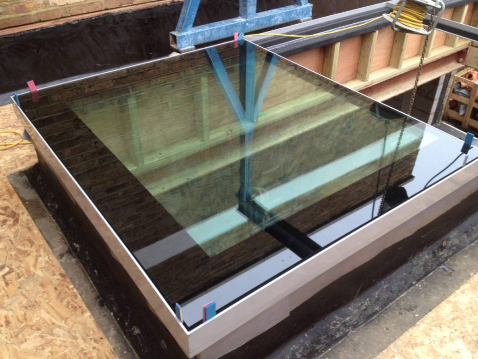 Glass floor panel being installed