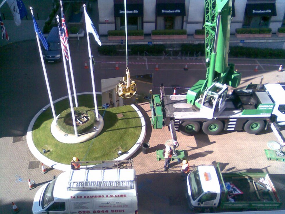 mirrored glass pane being moved
