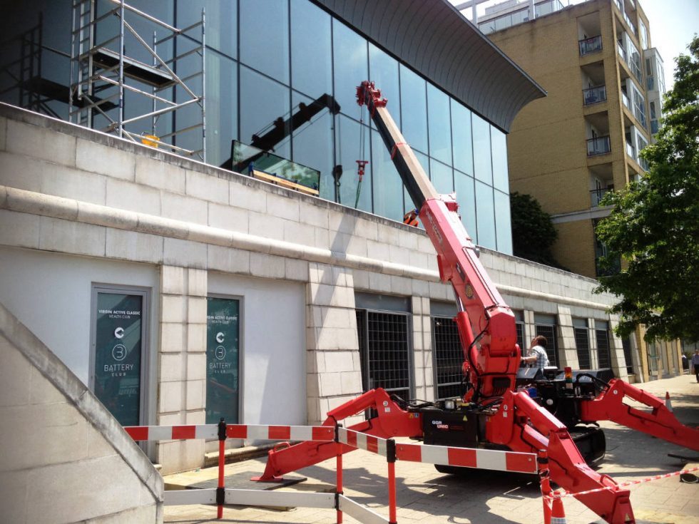 installing glass for a shops facade